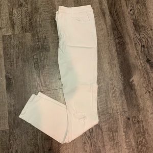 Distressed white jeans